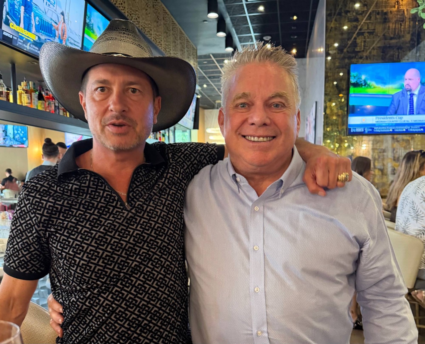 Billy Martin Jr. and Steve Bender smiling together, arm in arm